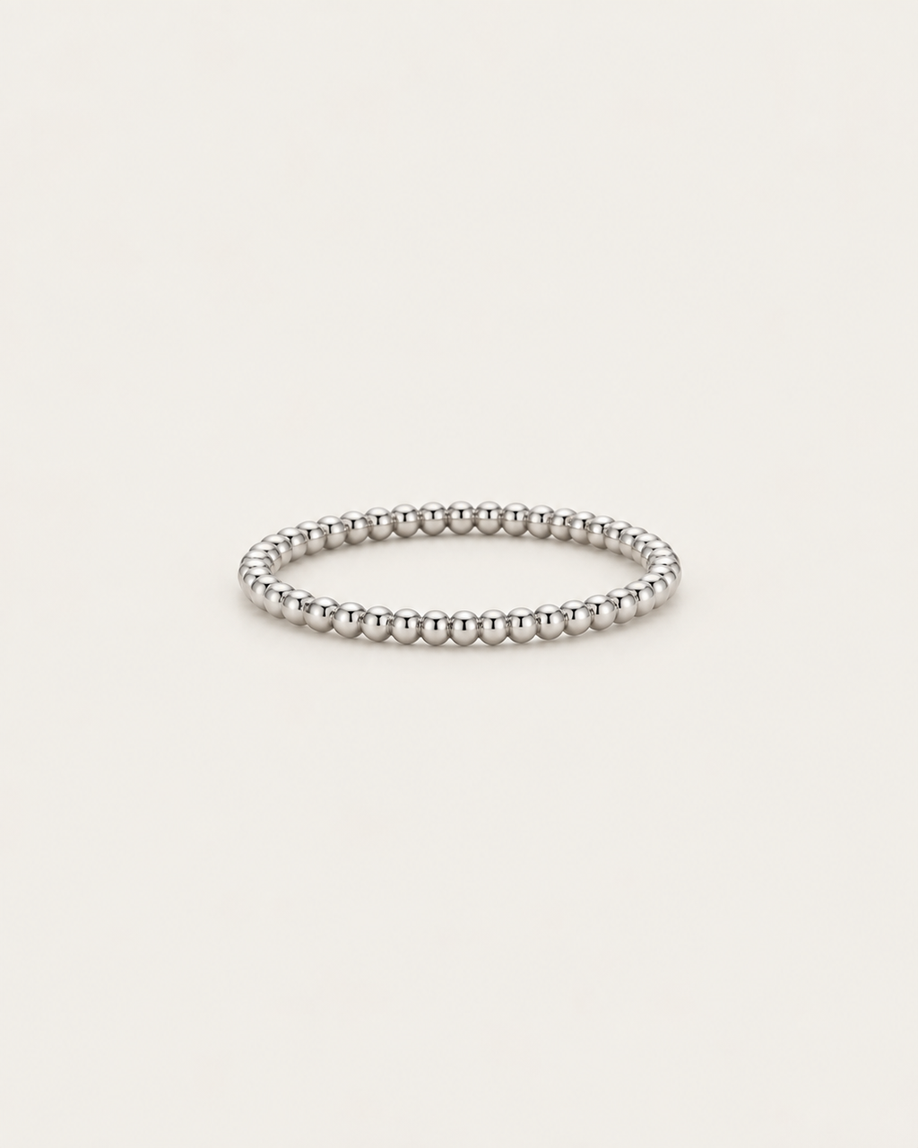 Silver-tone beaded band ring shown on its own.