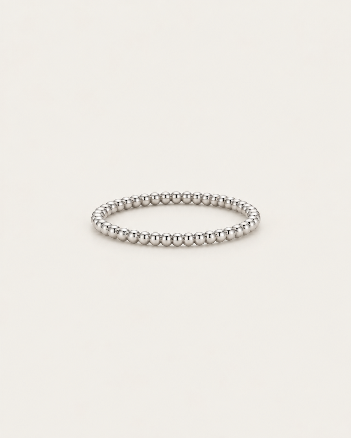 Silver-tone beaded band ring shown on its own.