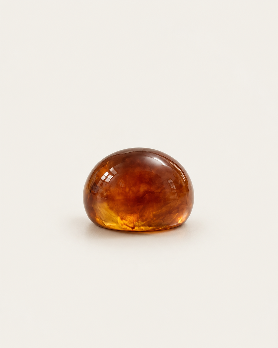 Brown marbled dome ring, front view of the rounded surface.
