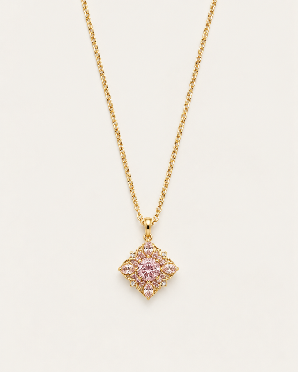 Gold-tone necklace with a pink flower pendant, front view of the petal cluster.