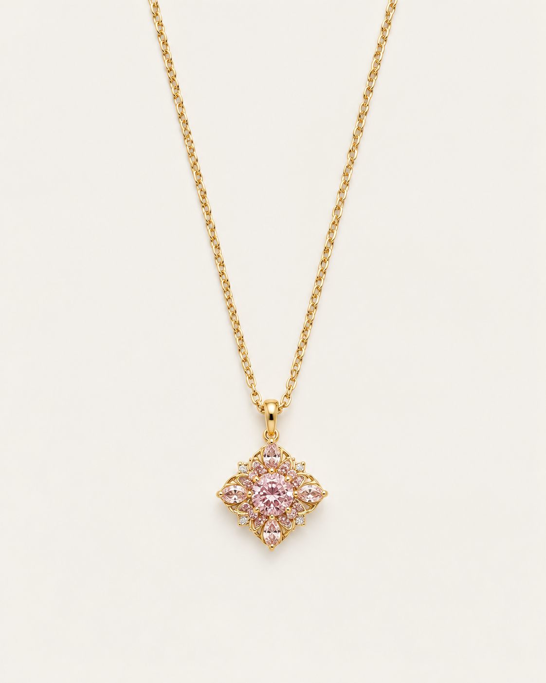 Gold-tone necklace with a pink flower pendant, front view of the petal cluster.