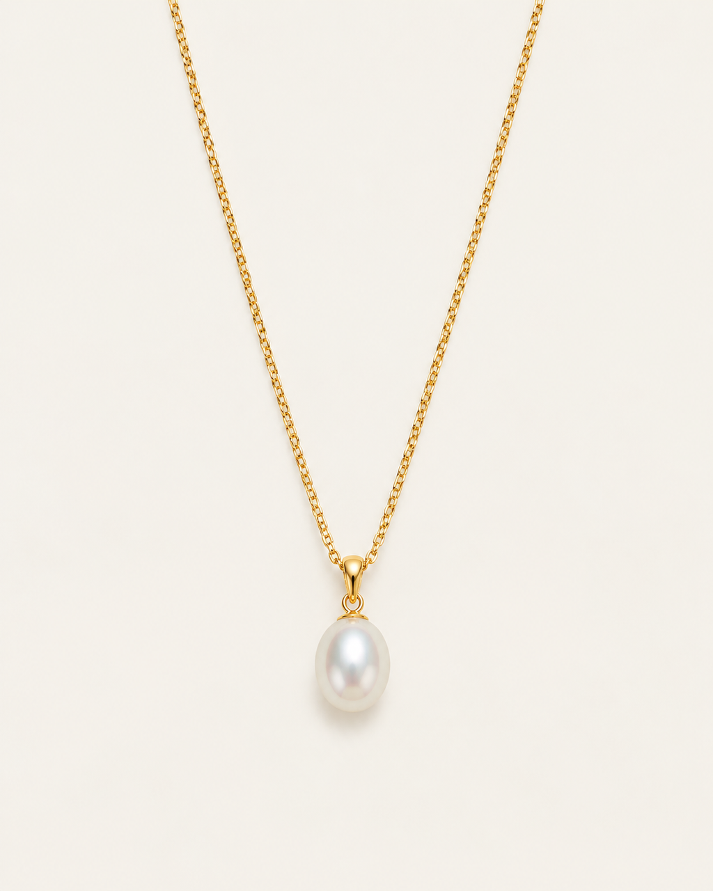 Gold-tone necklace with a white drop pendant, front view on a fine chain.