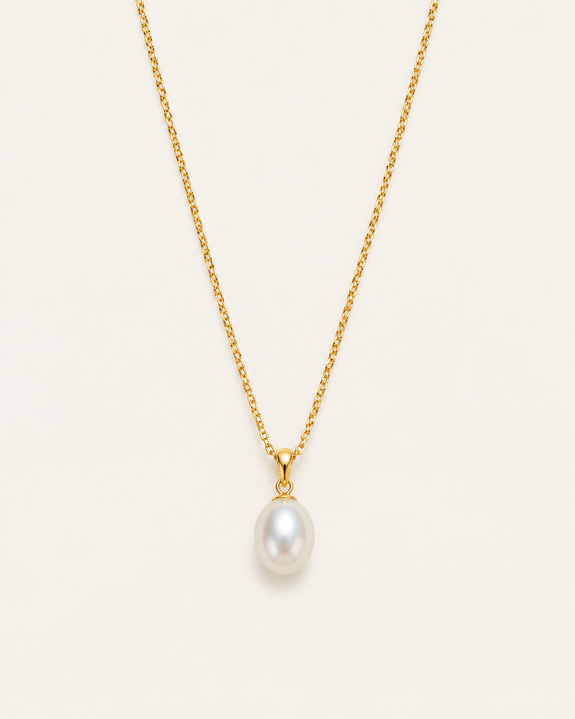 Gold-tone necklace with a white drop pendant, front view on a fine chain.
