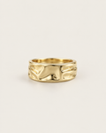 Gold-tone open band ring with a folded surface, front view.