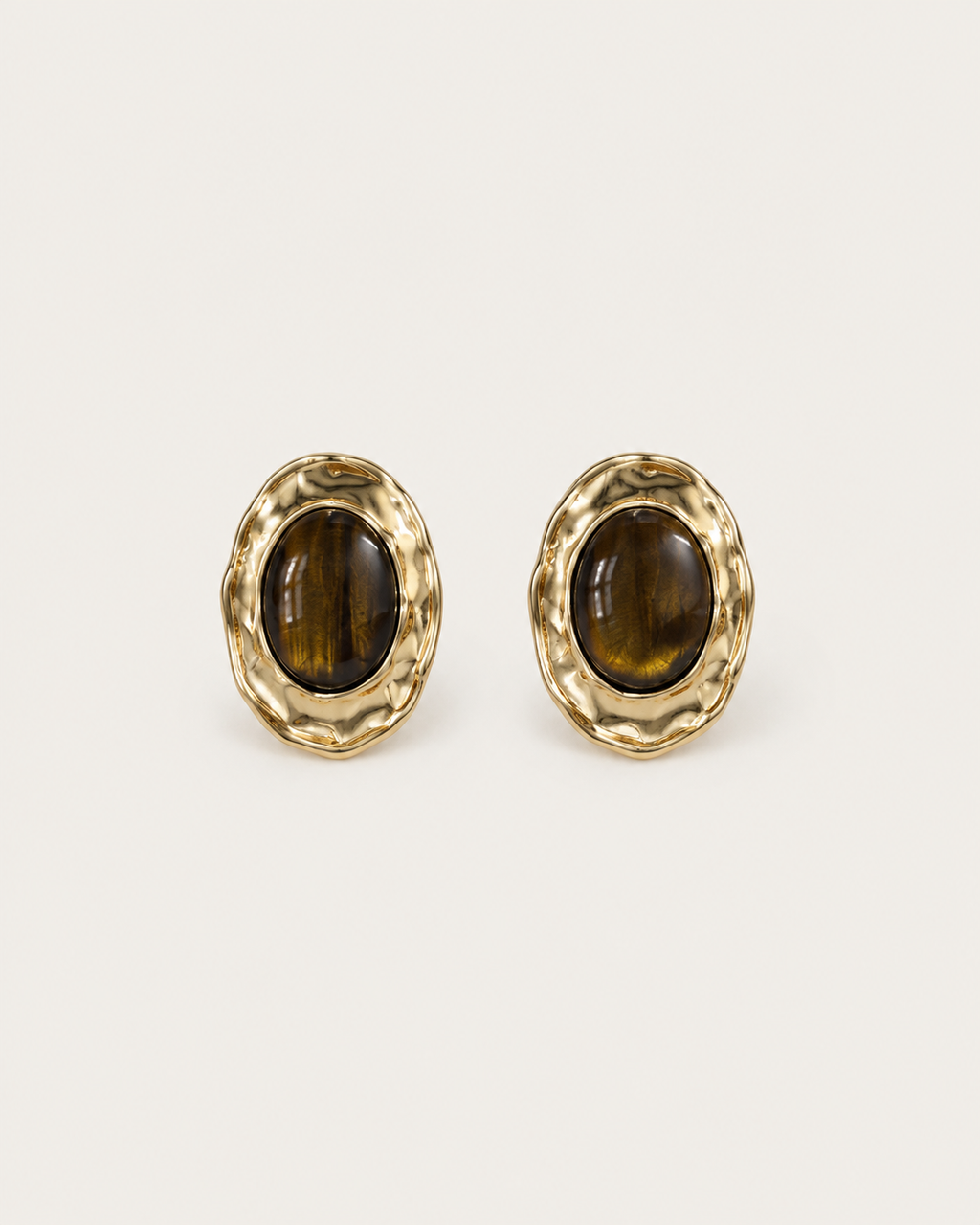 Pair of brown oval stud earrings with hammered gold-tone frames, shown together.
