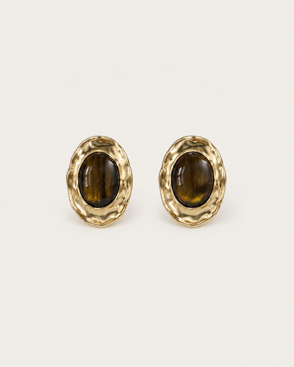 Pair of brown oval stud earrings with hammered gold-tone frames, shown together.
