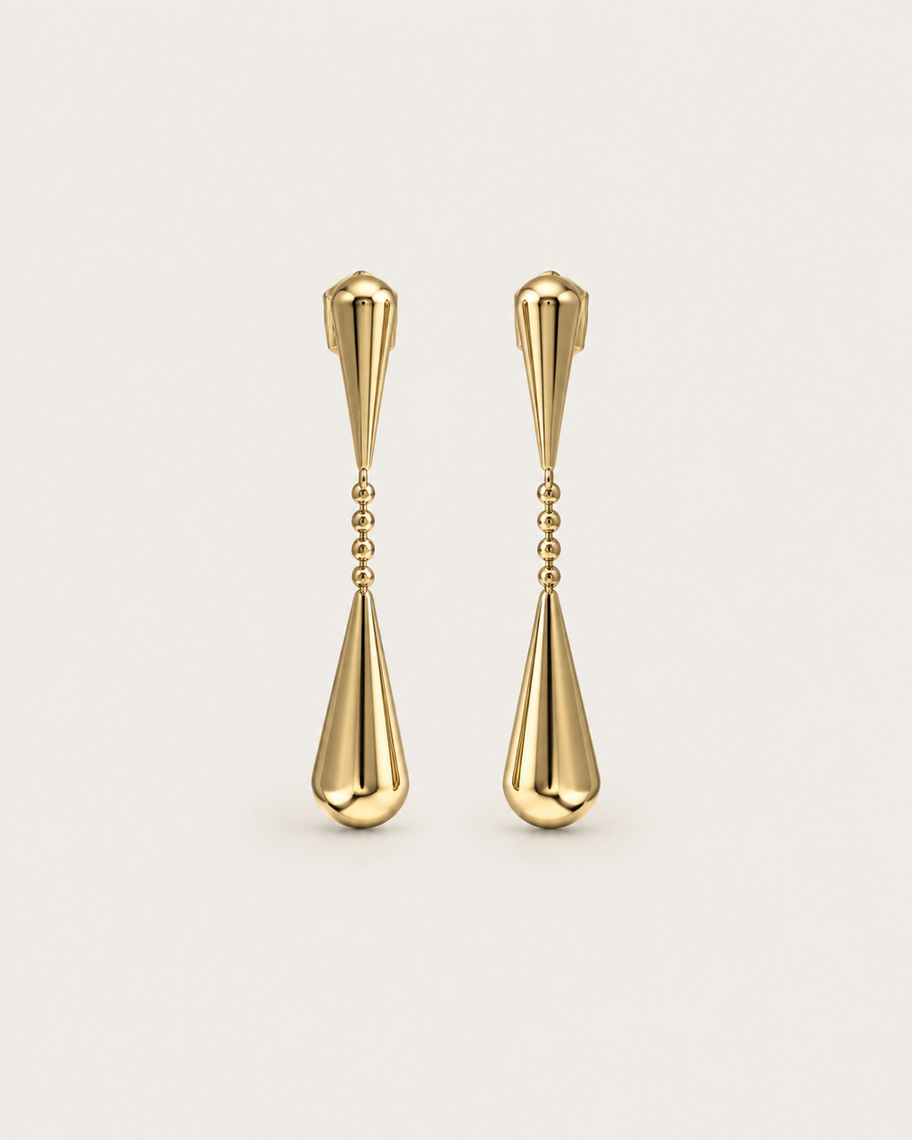 Pair of gold-tone linked teardrop earrings, shown together with elongated drops.