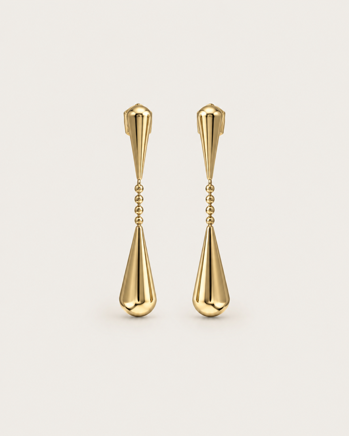Pair of gold-tone linked teardrop earrings, shown together with elongated drops.