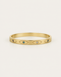 Gold-tone bangle with eye motifs and coloured centres, front view.