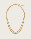 Gold-tone double-strand chain necklace with flat accents, laid out with the clasp visible.