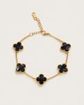 Chain bracelet with five dark-inlay clover stations, laid out on its own.