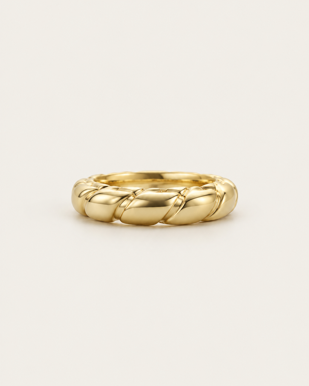 Gold-tone band ring with interwoven rounded twists, front view.