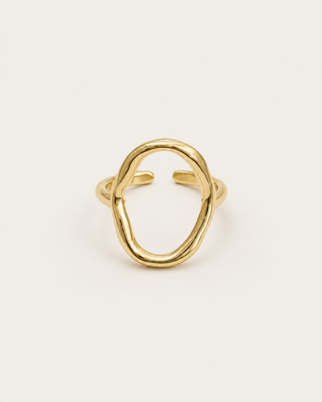 Gold-tone open ring with a tall hollow oval outline, front view.