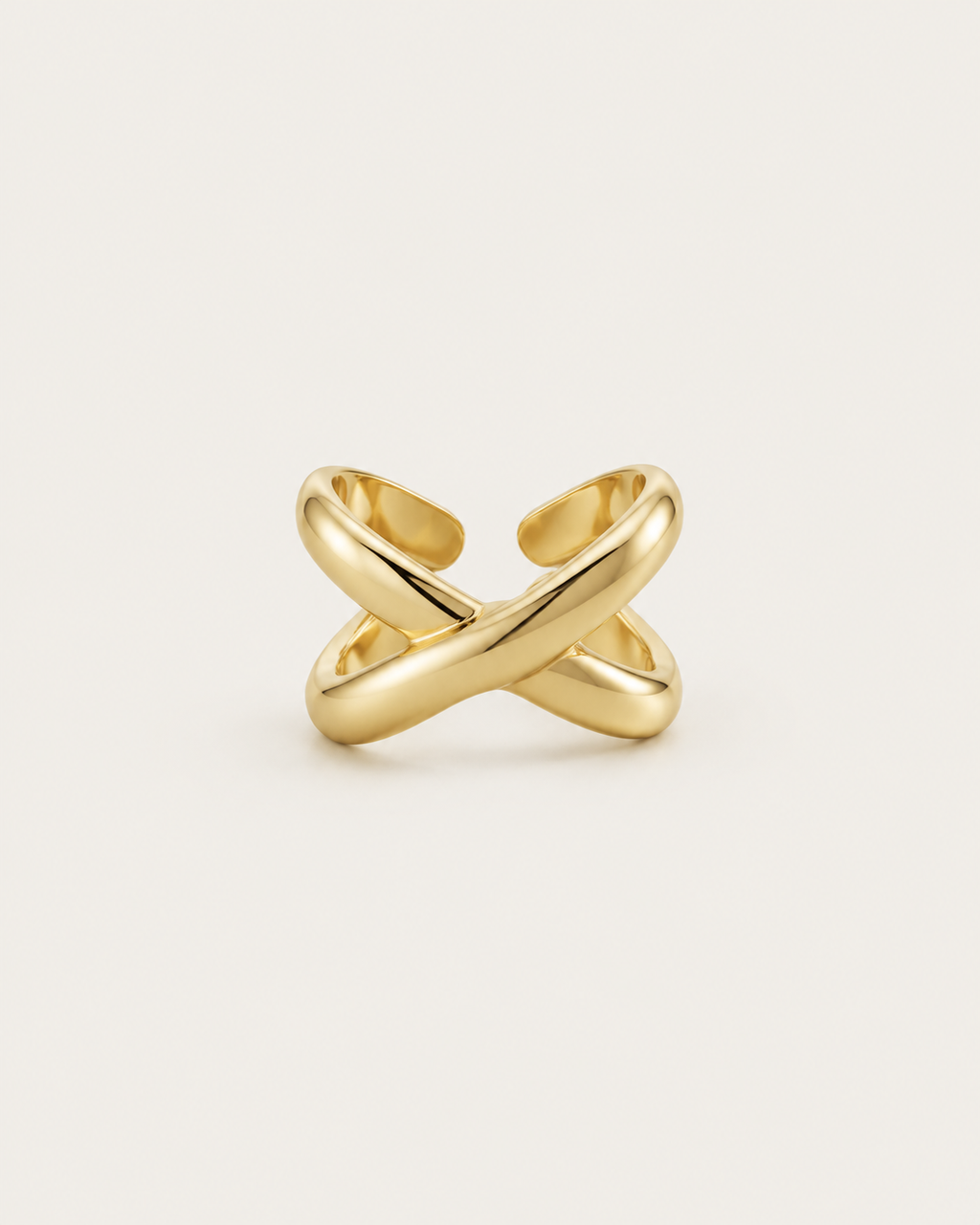 Gold-tone open ring with chunky crossover bands, front view.