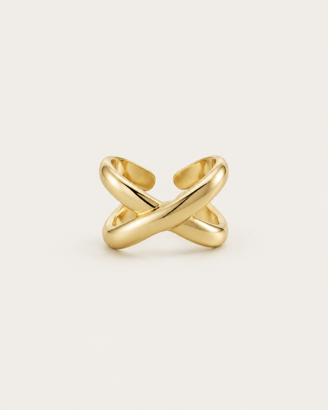 Gold-tone open ring with chunky crossover bands, front view.