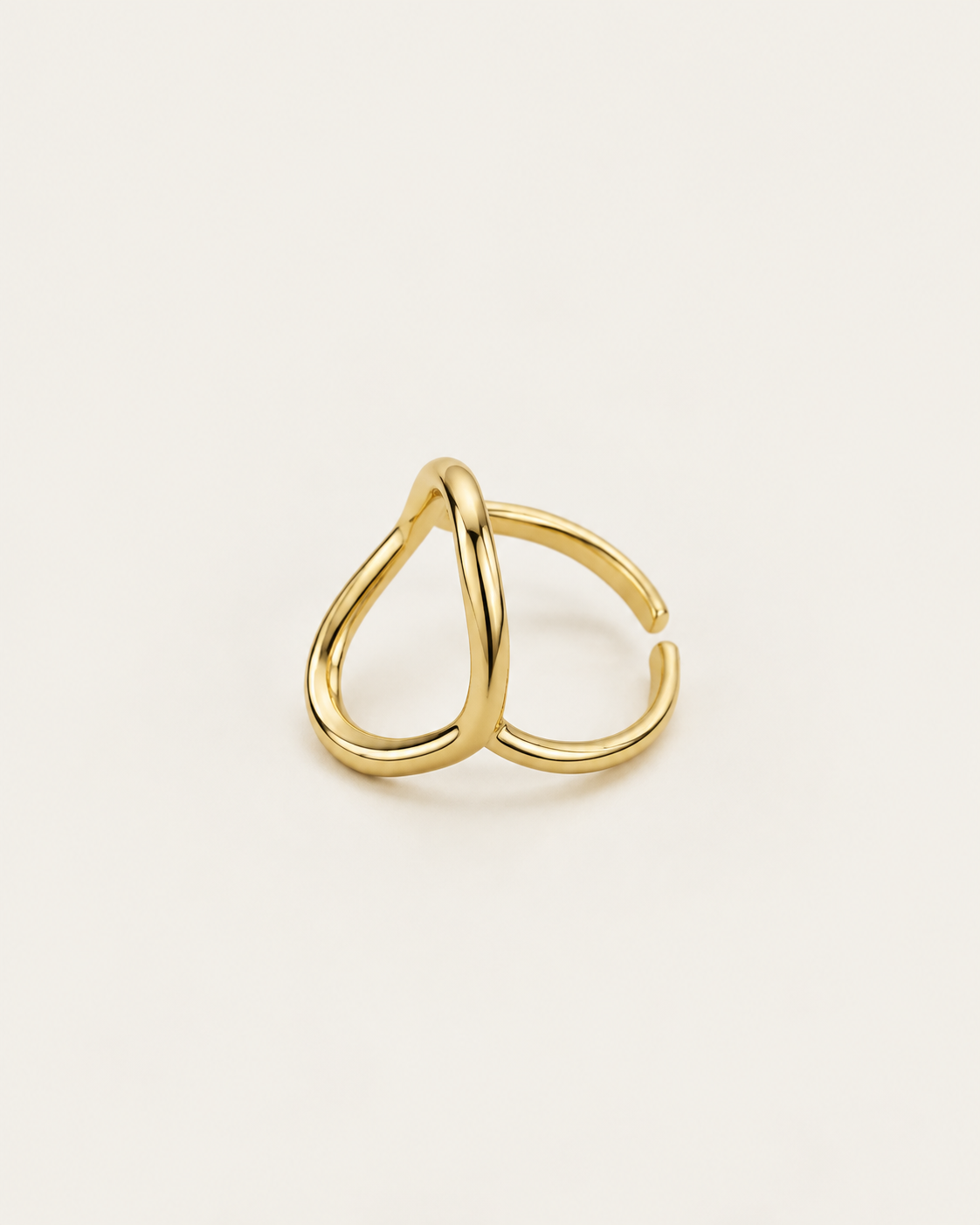Gold-tone open ring with a tall hollow oval outline, side view showing the curved outline and band.