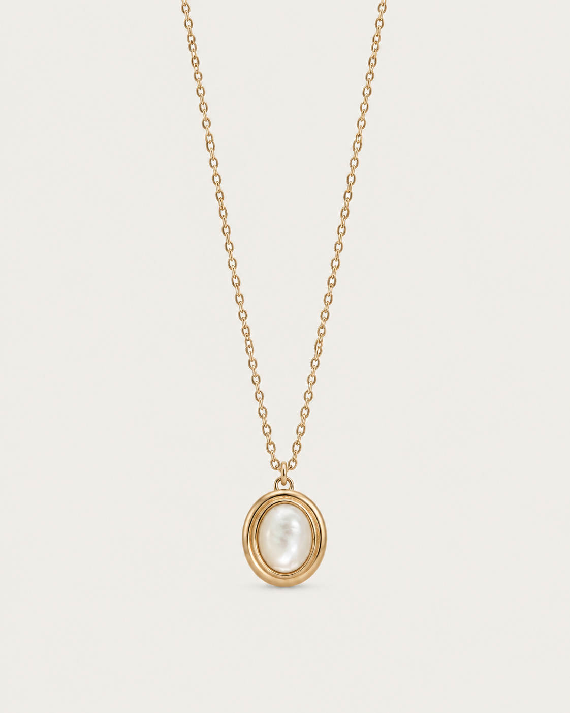 Gold-tone necklace with a white oval accent in a double-rimmed pendant, front view.