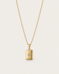 Gold-tone necklace with a rectangular celestial-motif tag pendant, front view.