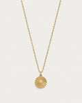Gold-tone necklace with a round sunburst coin pendant, front view.