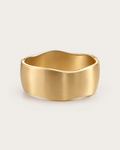 Gold-tone wide bangle with a satin-looking surface and wavy edges, front view.