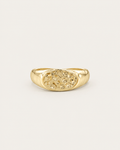 Gold-tone ring with a hammered oval dome, front view.