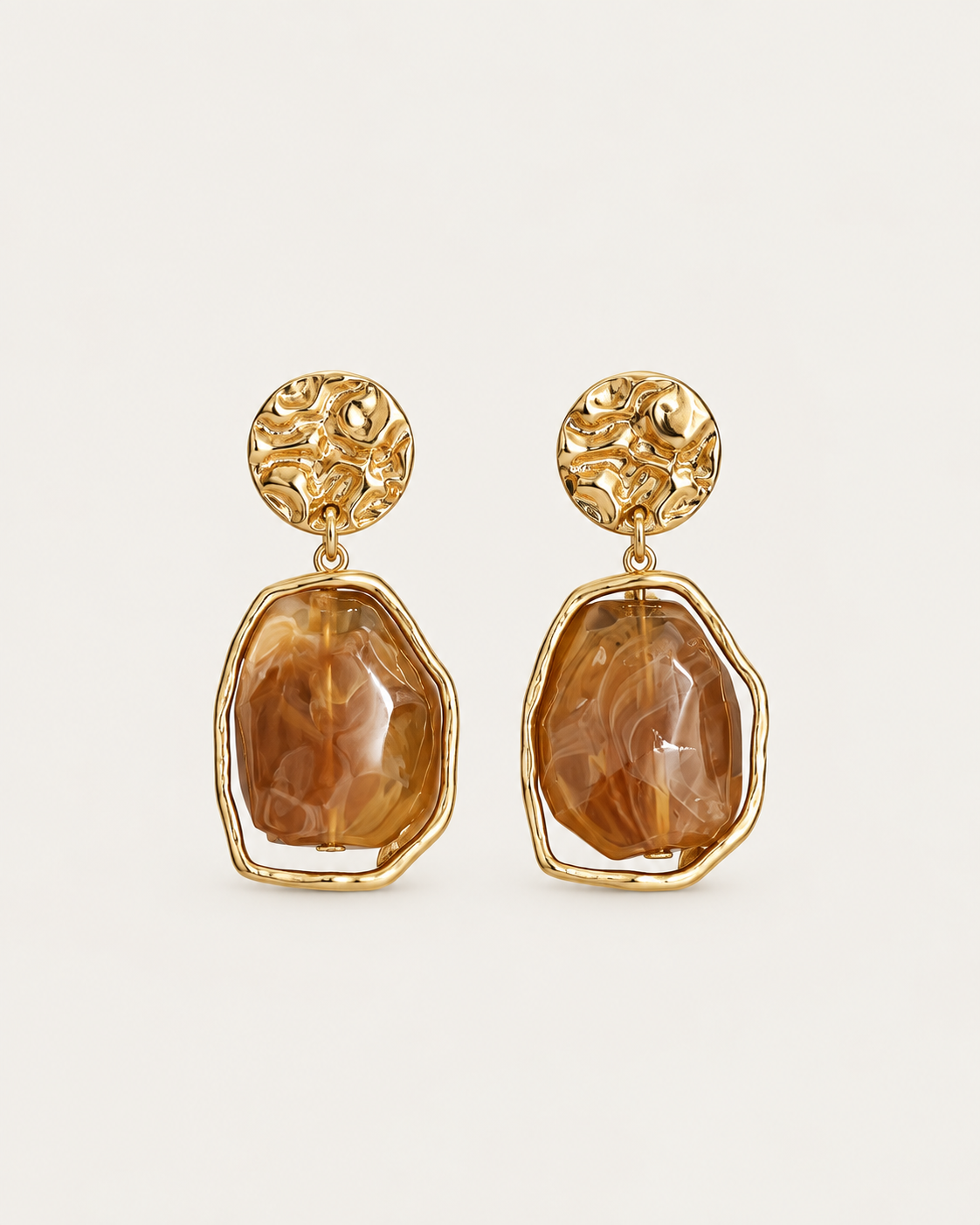Pair of faceted brown drop earrings with gold-tone frames and textured round tops, shown together.