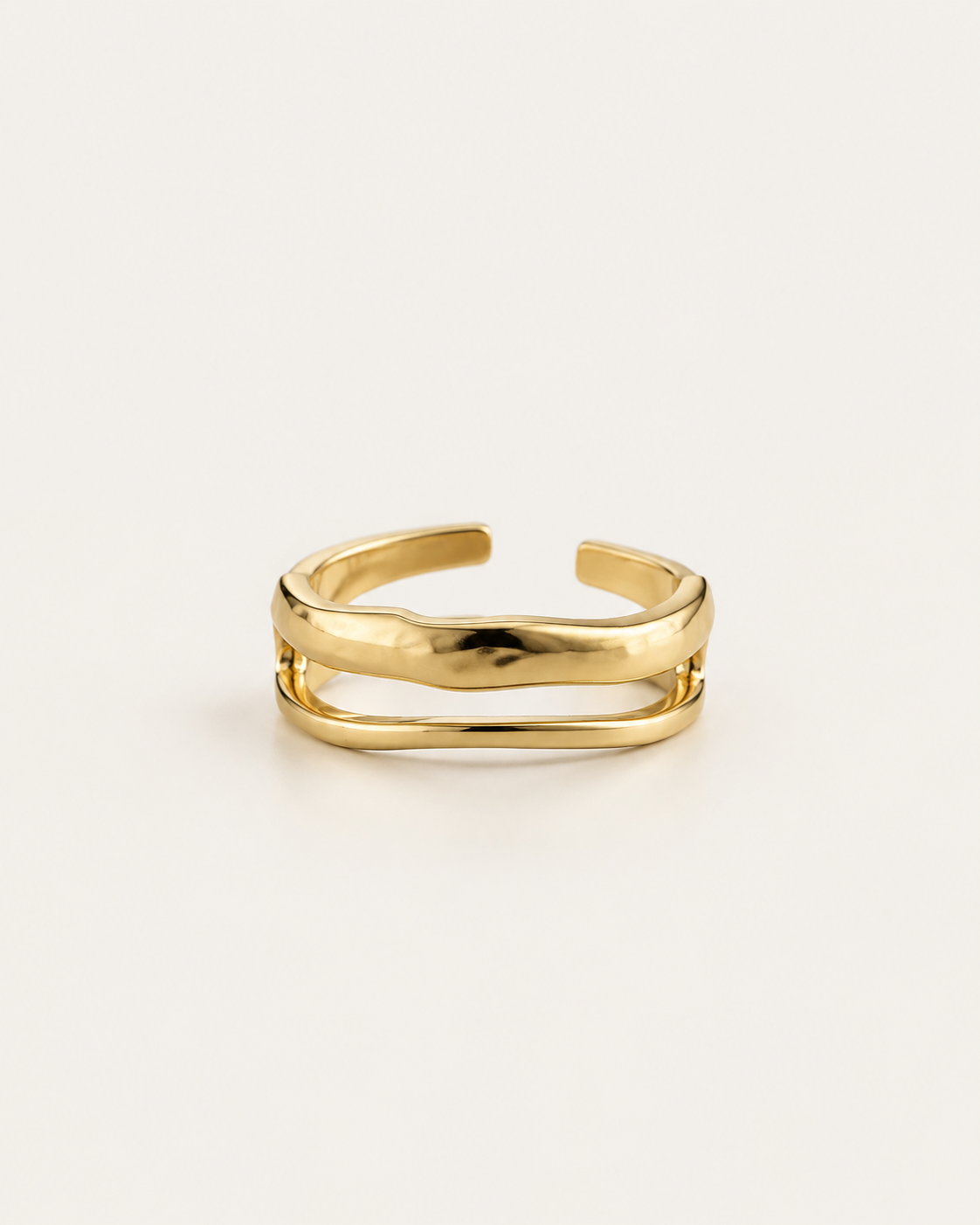 Gold-tone ring with two uneven connected bands, front view of the open back.
