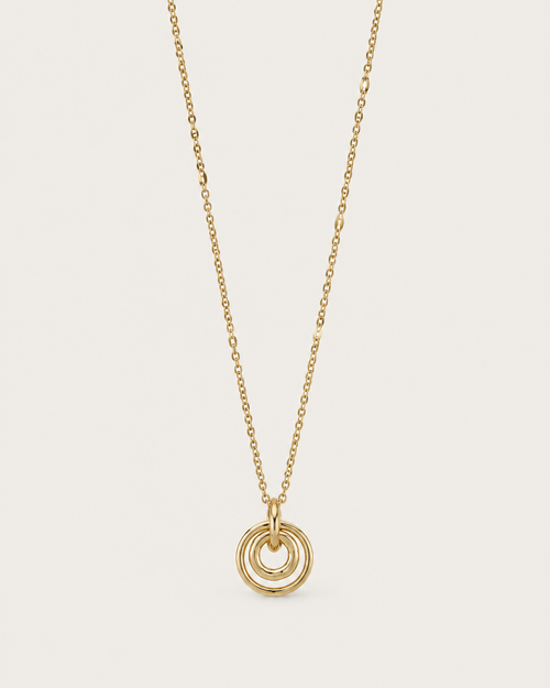 Gold-tone necklace with concentric circle pendants, front view.
