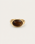 Gold-tone ring with a horizontal brown oval accent, front view.