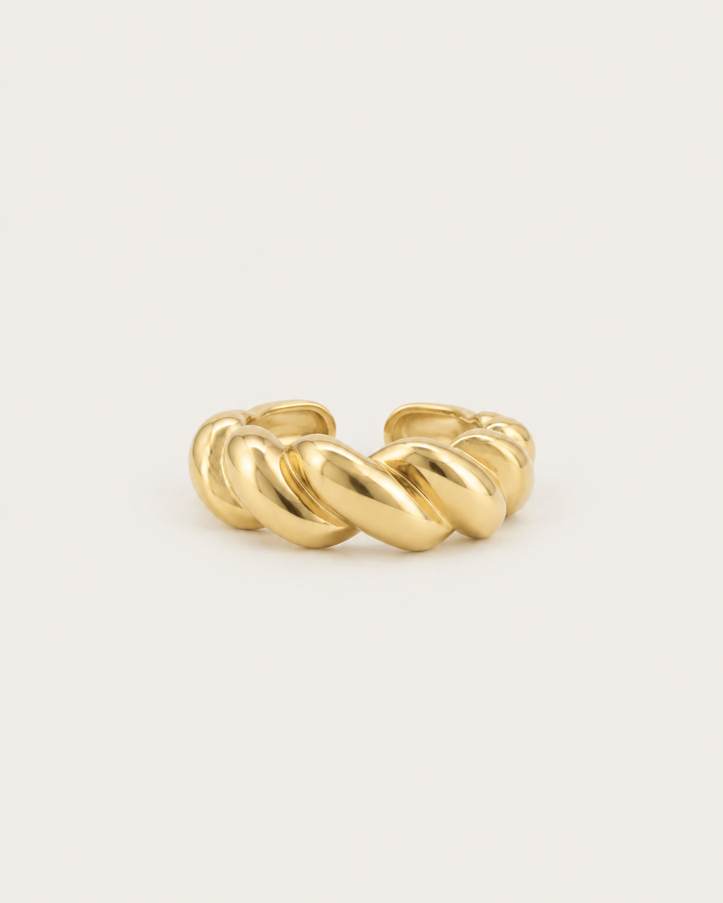 Gold-tone open band ring with a cable-twist pattern, front view.