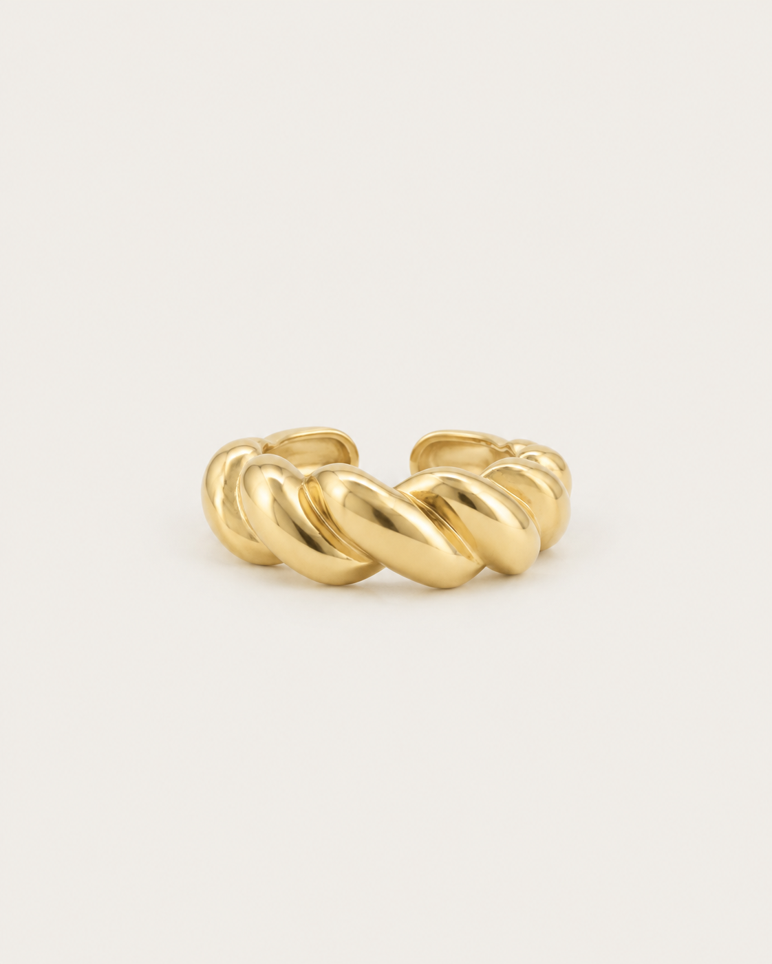 Gold-tone open band ring with a cable-twist pattern, front view.