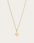 Gold-tone necklace with an eight-point star pendant, front view.