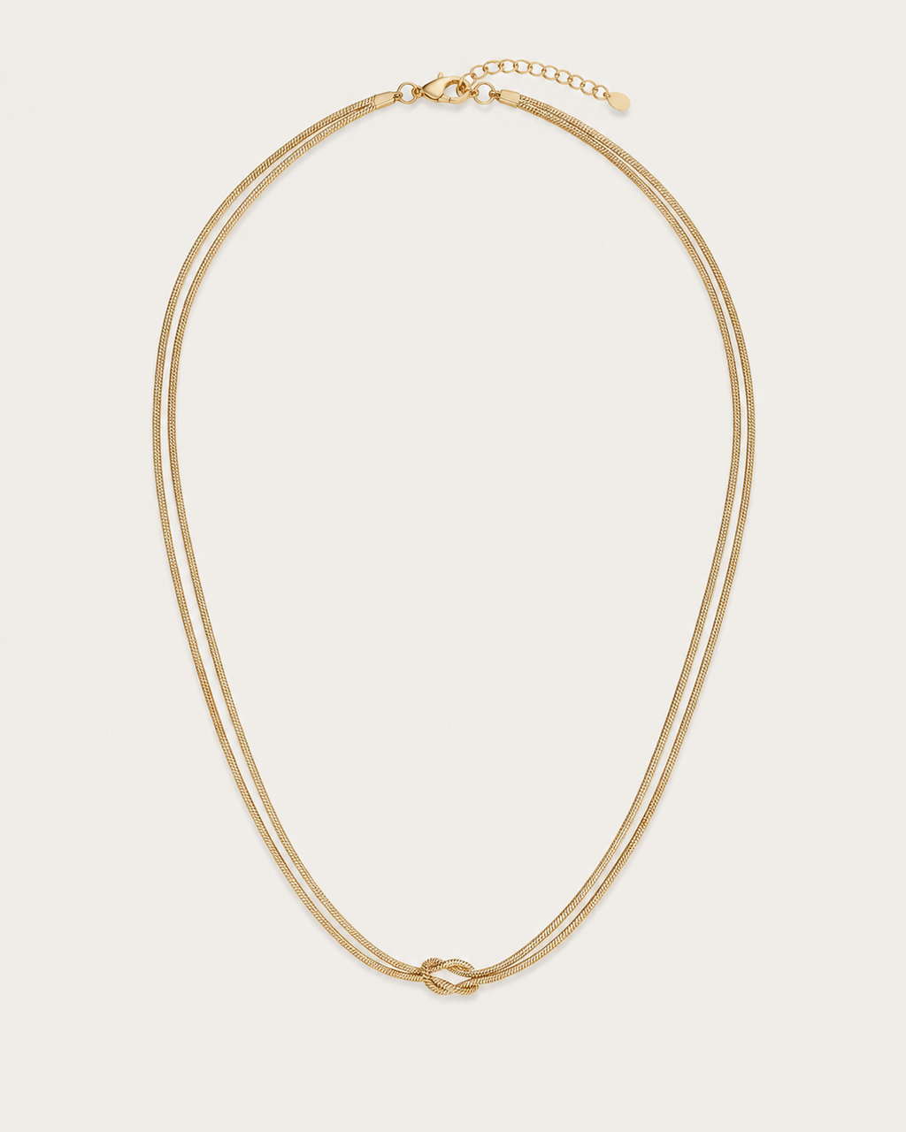 Gold-tone double-chain necklace with a central knot, front view.