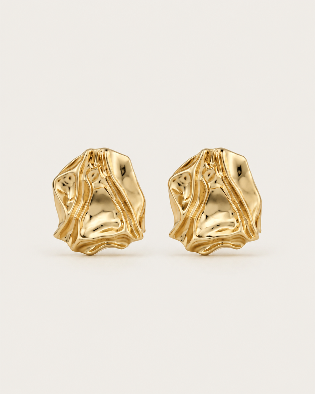 Pair of gold-tone crumpled stud earrings with irregular folds, shown together.