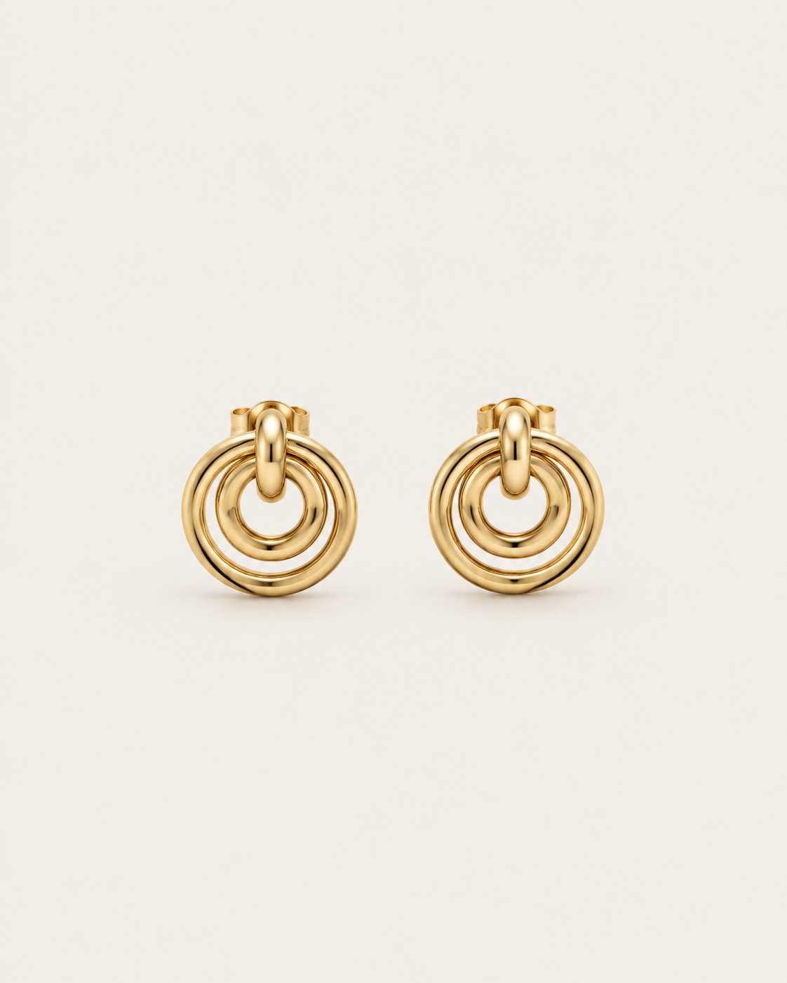 Pair of gold-tone concentric circle drop earrings, shown together.