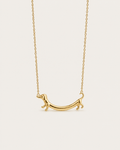 Gold-tone necklace with a dachshund-shaped pendant, front view.