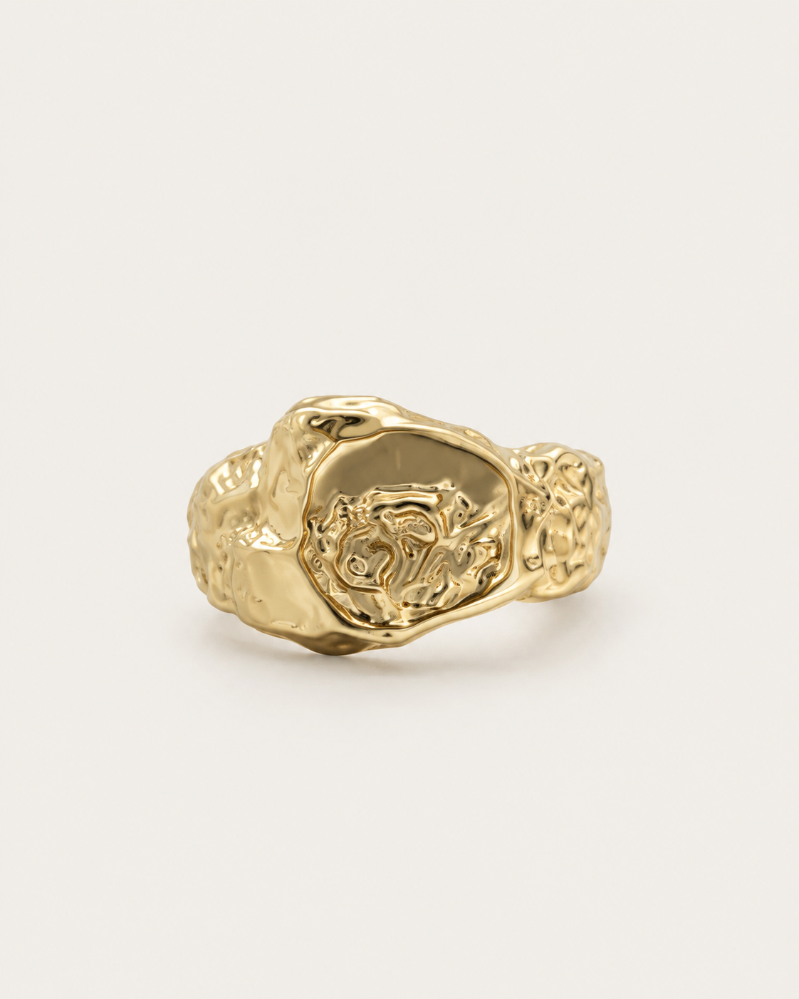 Gold-tone signet ring with an irregular molten-like texture, front view.