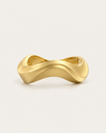 Gold-tone sculptural bangle with an undulating outline, front view.