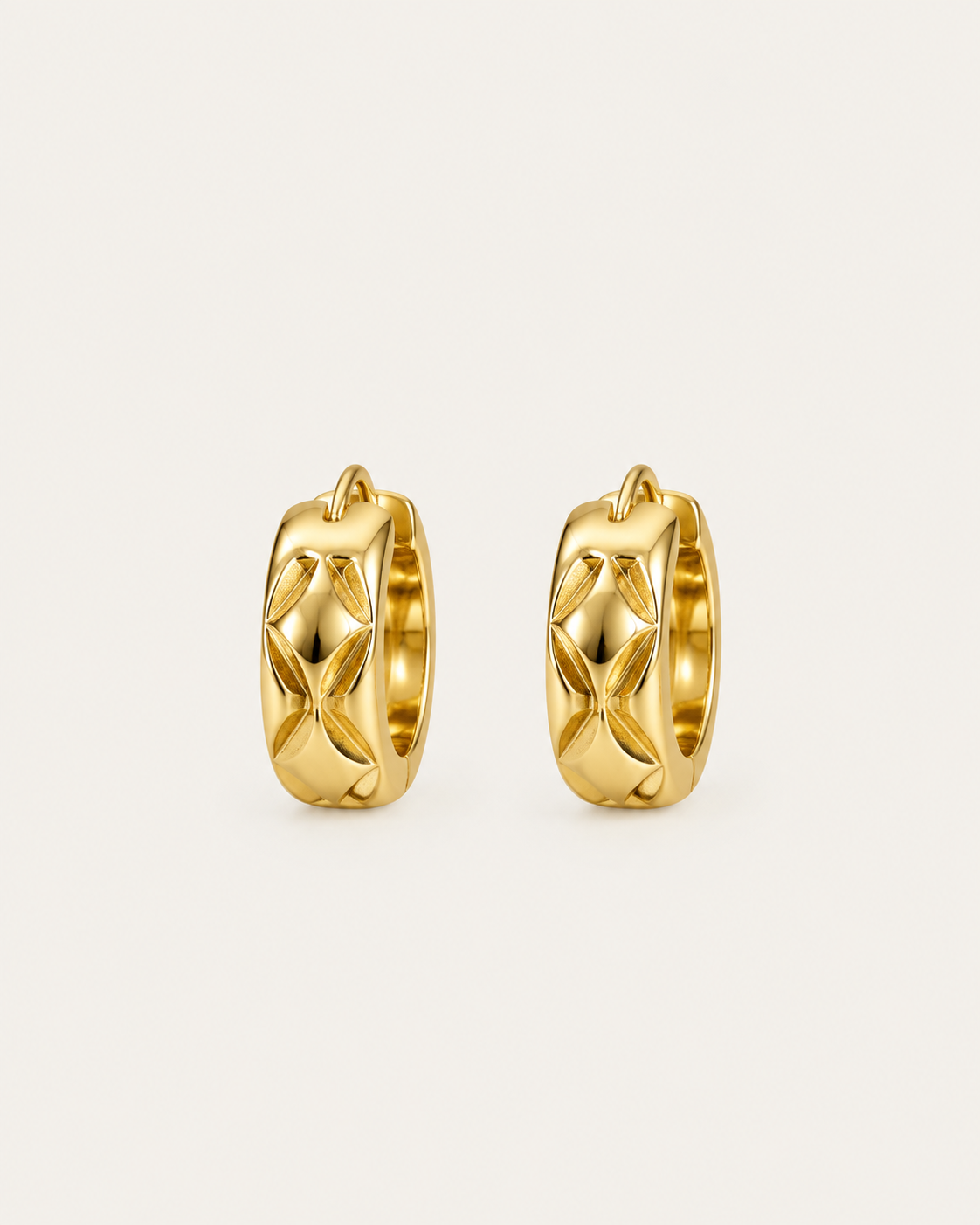 Pair of gold-tone huggie earrings with a quilted pattern, shown together.