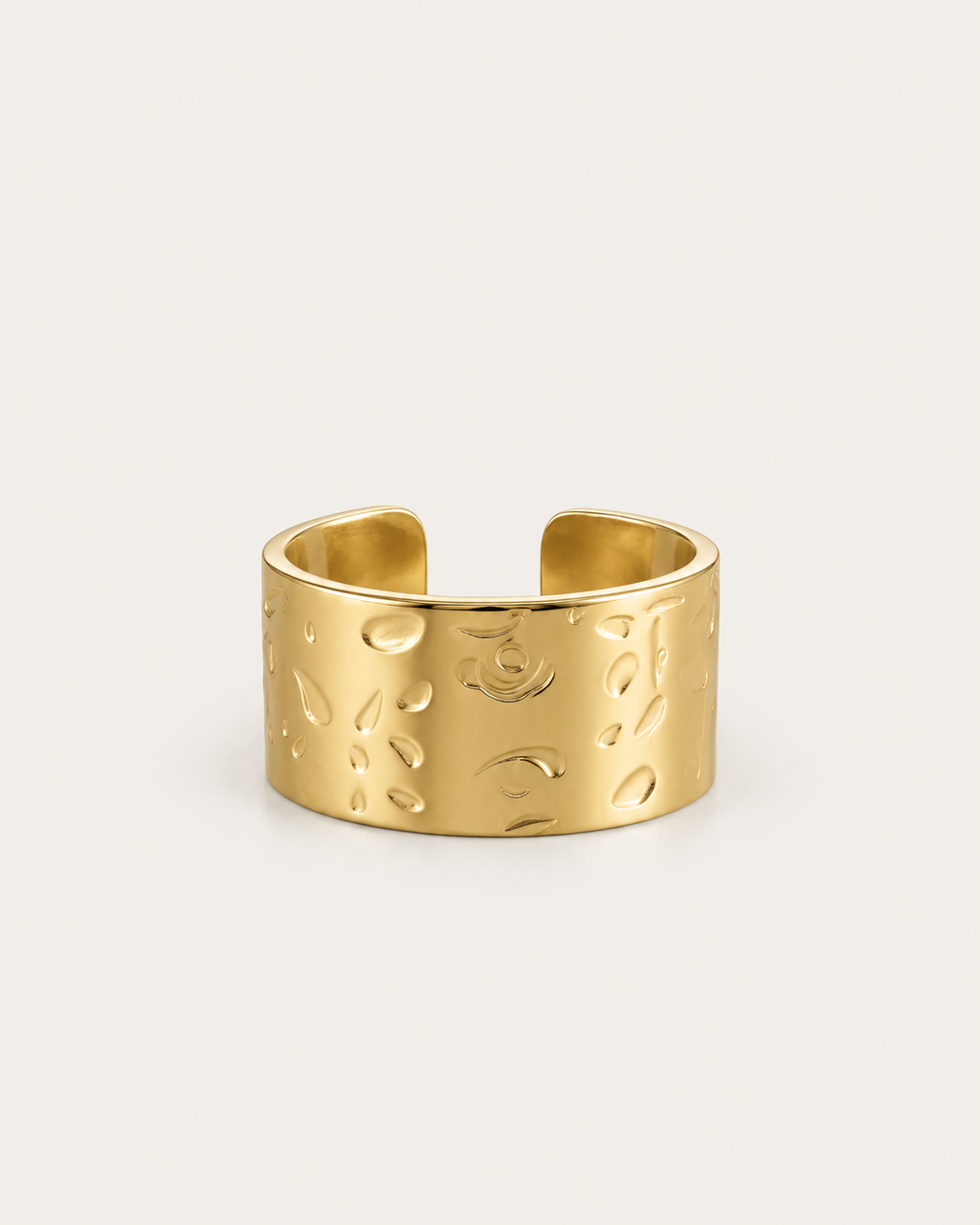 Wide gold-tone ring with a hammered surface, front view.