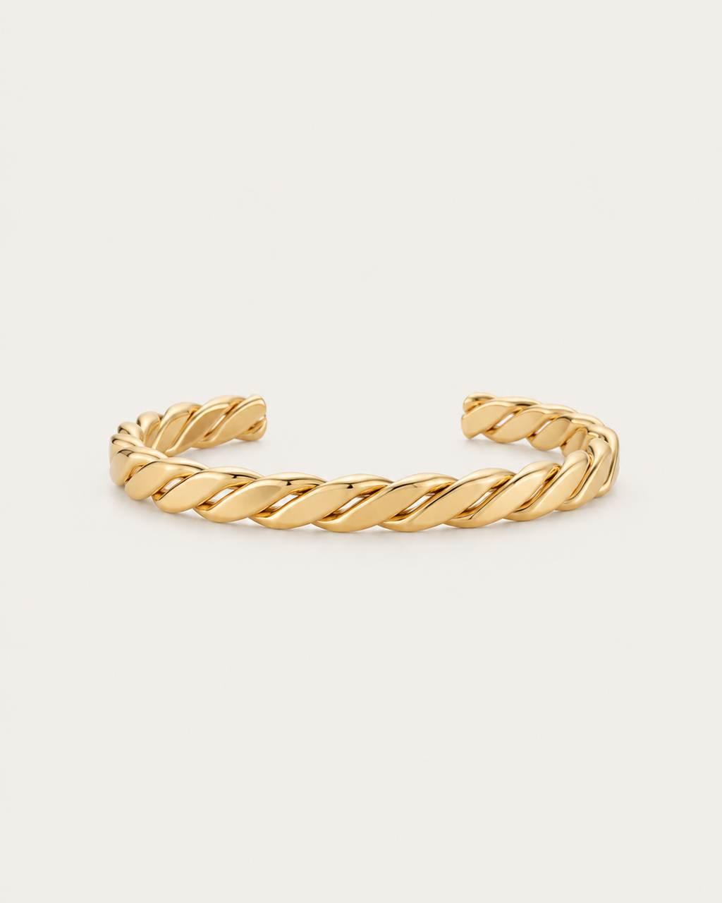 Gold-tone open bangle with a thick rope-twist pattern, front view.