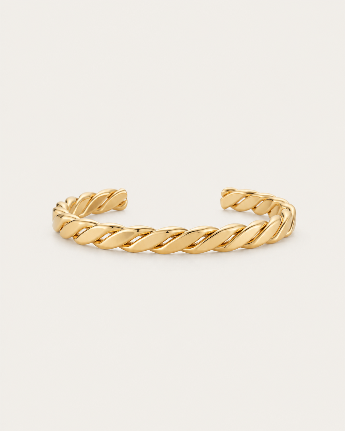 Gold-tone open bangle with a thick rope-twist pattern, front view.