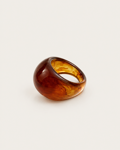 Brown marbled dome ring, angled view showing the opening.