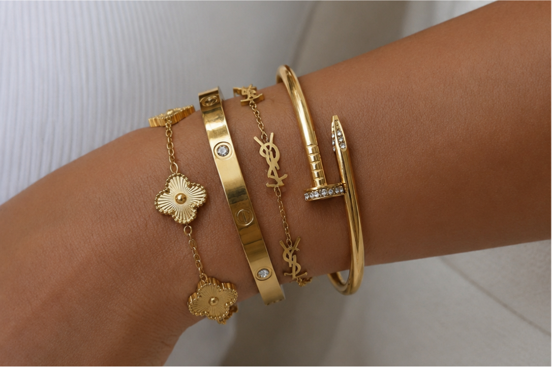 Close-up of a wrist wearing a bracelet stack.