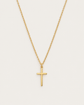 Gold-tone cross pendant hanging from a fine chain against a light background.