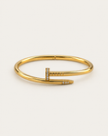 Gold-tone pavé nail bangle with stone accents at the head and tip