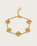 Gold-tone chain bracelet with five ridged clover stations and an extension chain.